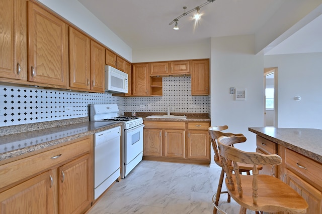 7321 W Fullerton Ave Unit 10, Elmwood Park, IL 60707 - kitchen featuring white appliances, a sink, light marble finish floors, and backsplash