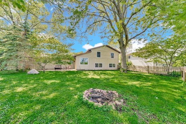 1006 Monroe St, Wauconda, IL 60084 - back of house featuring a patio area and an outdoor fire pit