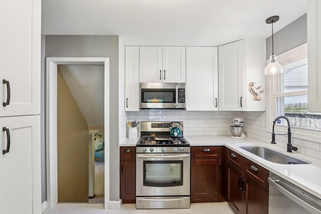 N074 Nepil Ave, Wheaton, IL 60187 - kitchen with stainless steel appliances, light countertops, decorative backsplash, and white cabinets