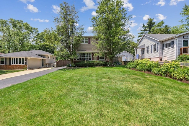 N074 Nepil Ave, Wheaton, IL 60187 - view of front facade featuring driveway and a front yard