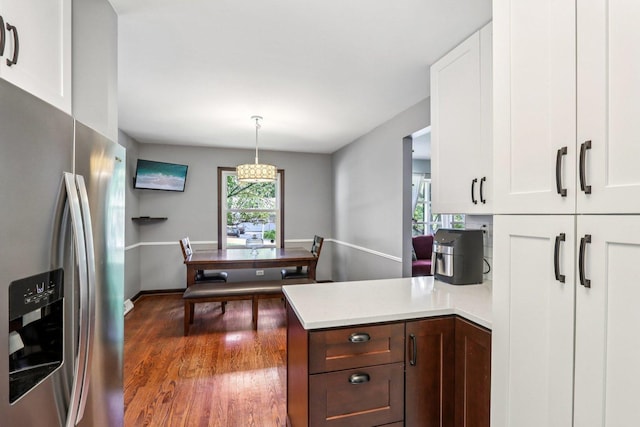 N074 Nepil Ave, Wheaton, IL 60187 - kitchen with stainless steel fridge, white cabinetry, a peninsula, dark wood-style floors, and light countertops