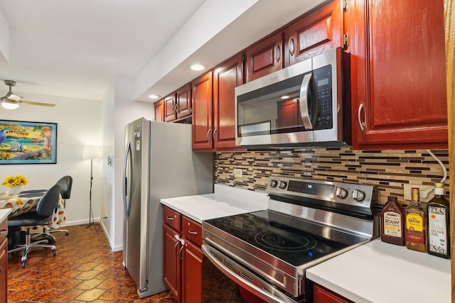 9346 Landings Ln Unit 506, Des Plaines, IL 60016 - kitchen featuring appliances with stainless steel finishes, reddish brown cabinets, tasteful backsplash, and recessed lighting