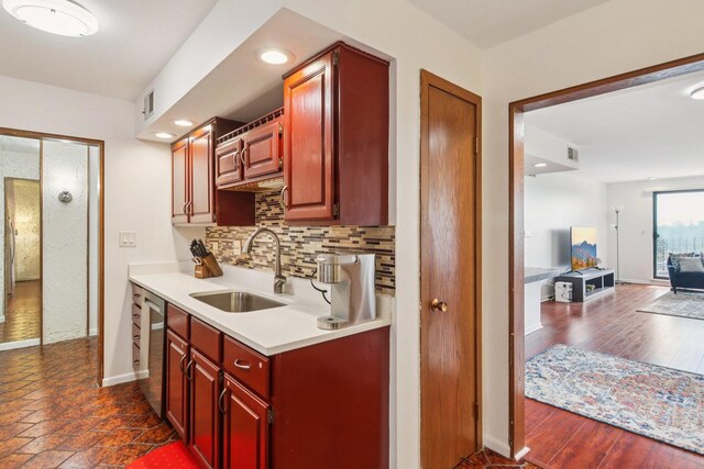 9346 Landings Ln Unit 506, Des Plaines, IL 60016 - kitchen featuring a sink, light countertops, tasteful backsplash, dishwasher, and baseboards