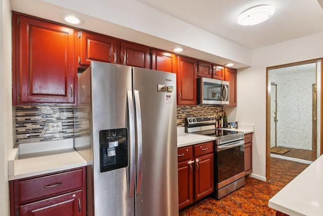9346 Landings Ln Unit 506, Des Plaines, IL 60016 - kitchen featuring stainless steel appliances, light countertops, decorative backsplash, reddish brown cabinets, and recessed lighting