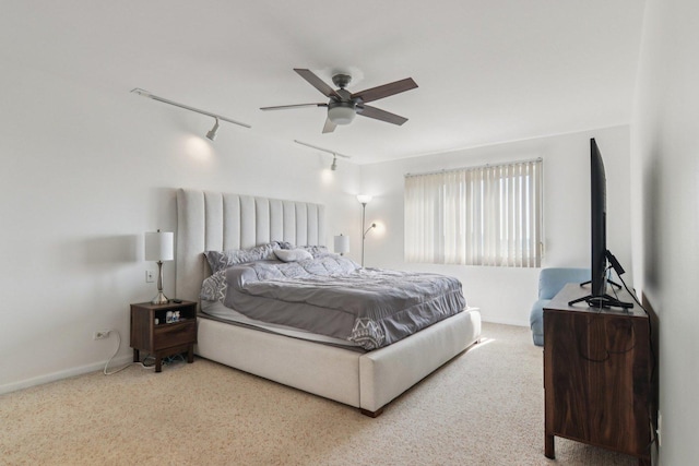 9346 Landings Ln Unit 506, Des Plaines, IL 60016 - carpeted bedroom with rail lighting, baseboards, and a ceiling fan