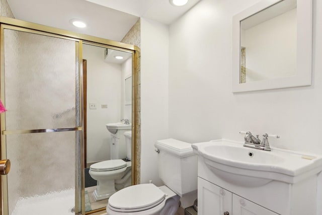 9346 Landings Ln Unit 506, Des Plaines, IL 60016 - bathroom with toilet, a stall shower, a sink, and recessed lighting