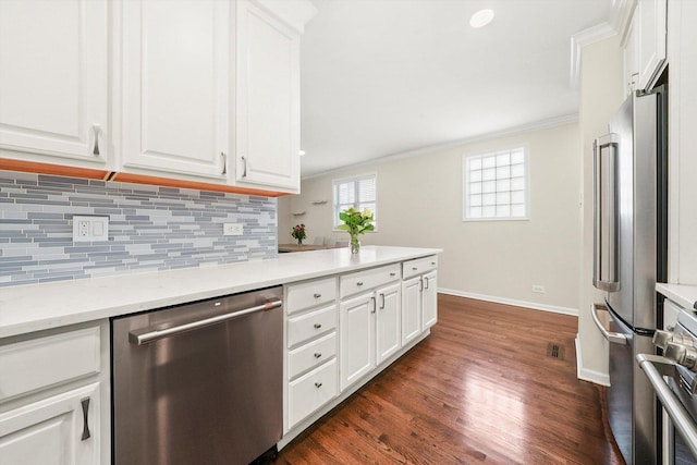 3353 N Kenmore Ave Unit 1, Chicago, IL 60657 - kitchen featuring appliances with stainless steel finishes, decorative backsplash, crown molding, and white cabinets