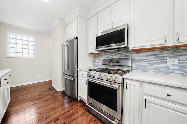 3353 N Kenmore Ave Unit 1, Chicago, IL 60657 - kitchen with stainless steel appliances, crown molding, tasteful backsplash, and white cabinetry