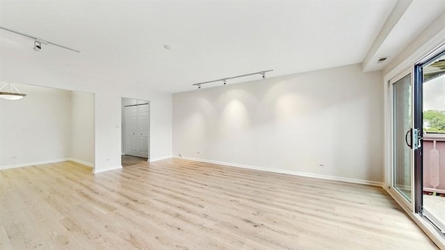 12900 W Heiden Cir Unit 4301, Lake Bluff, IL 60044 - spare room with track lighting and light wood-type flooring