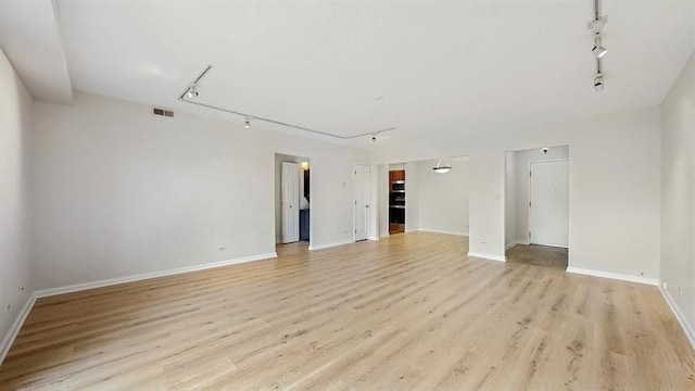 12900 W Heiden Cir Unit 4301, Lake Bluff, IL 60044 - empty room with track lighting and light wood-type flooring