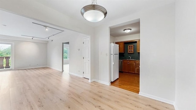 12900 W Heiden Cir Unit 4301, Lake Bluff, IL 60044 - spare room with healthy amount of natural light, light wood-style flooring, and track lighting