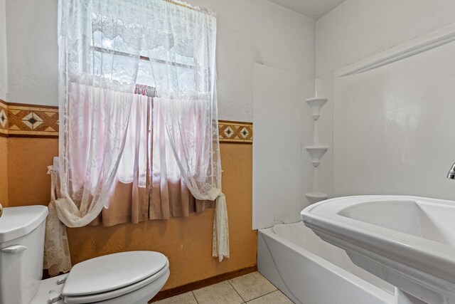 2611 Ellen St, Rockford, IL 61101 - full bathroom with toilet, tile patterned floors, tub / shower combination, and a sink