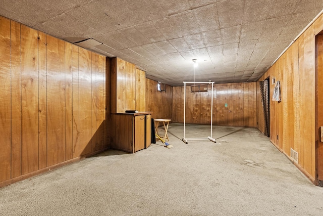 2611 Ellen St, Rockford, IL 61101 - finished basement featuring light colored carpet and wooden walls