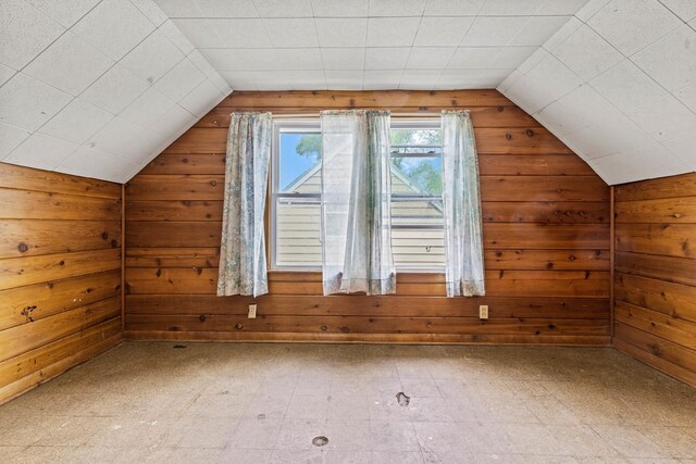 2611 Ellen St, Rockford, IL 61101 - bonus room featuring wood walls, vaulted ceiling, and tile patterned floors