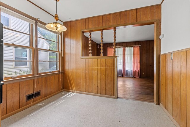 2611 Ellen St, Rockford, IL 61101 - unfurnished room with wooden walls and tile patterned floors