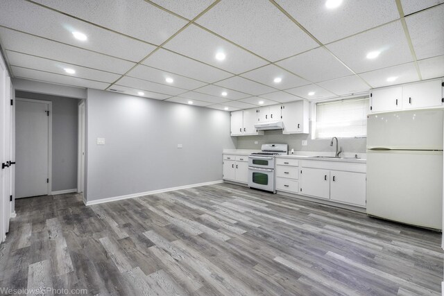 651 Clearmont Dr, Elk Grove Village, IL 60007 - kitchen featuring white appliances, a sink, light countertops, under cabinet range hood, and white cabinetry