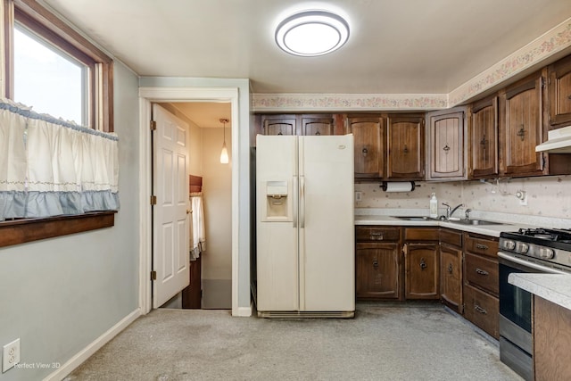 371 Elm St, Elgin, IL 60123 - kitchen featuring white fridge with ice dispenser, stainless steel range with gas stovetop, light countertops, and dark brown cabinets
