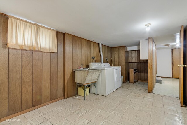 371 Elm St, Elgin, IL 60123 - laundry area featuring washing machine and clothes dryer, wooden walls, and light flooring