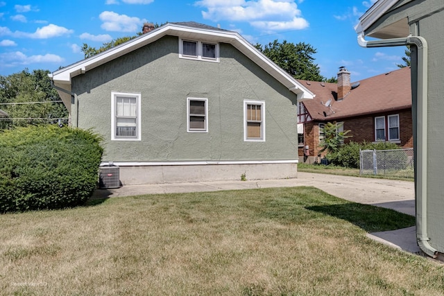 371 Elm St, Elgin, IL 60123 - rear view of property featuring stucco siding