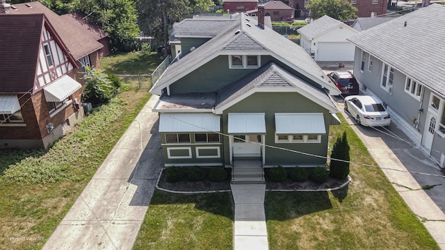 371 Elm St, Elgin, IL 60123 - view of front of property featuring a shingled roof, a front lawn, and a residential view