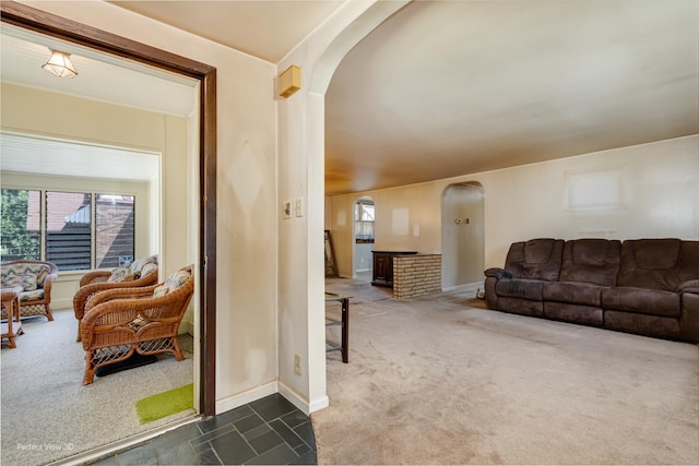 371 Elm St, Elgin, IL 60123 - carpeted living room with arched walkways and tile patterned floors