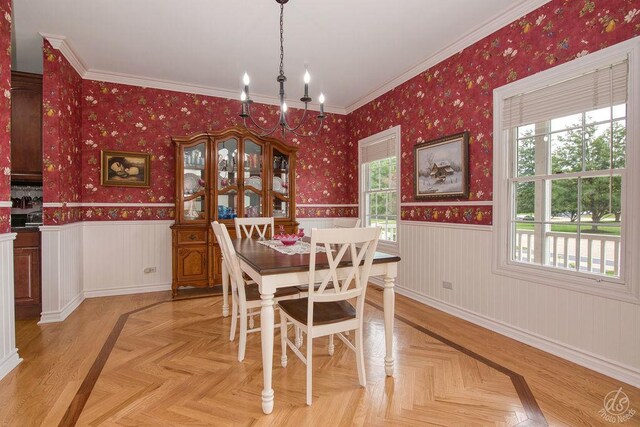 141 Mary Hamsmith Ct, Sycamore, IL 60178 - dining room featuring plenty of natural light, a chandelier, a wainscoted wall, wallpapered walls, and ornamental molding