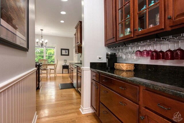 141 Mary Hamsmith Ct, Sycamore, IL 60178 - bar with light wood finished floors, a chandelier, decorative light fixtures, and recessed lighting