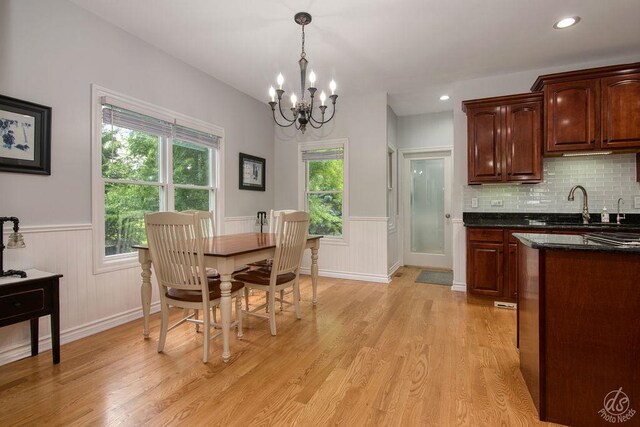 141 Mary Hamsmith Ct, Sycamore, IL 60178 - dining space with wainscoting, a chandelier, light wood finished floors, and recessed lighting