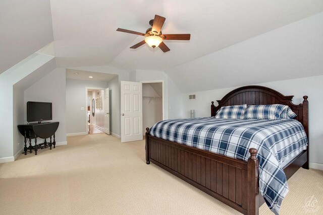 141 Mary Hamsmith Ct, Sycamore, IL 60178 - bedroom featuring light carpet, vaulted ceiling, baseboards, and a ceiling fan