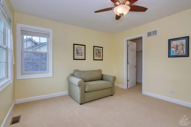 141 Mary Hamsmith Ct, Sycamore, IL 60178 - sitting room with light colored carpet, baseboards, and ceiling fan