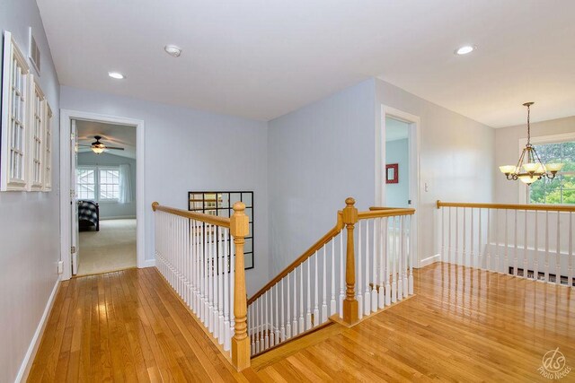141 Mary Hamsmith Ct, Sycamore, IL 60178 - hallway with an upstairs landing, hardwood / wood-style flooring, baseboards, healthy amount of natural light, and recessed lighting