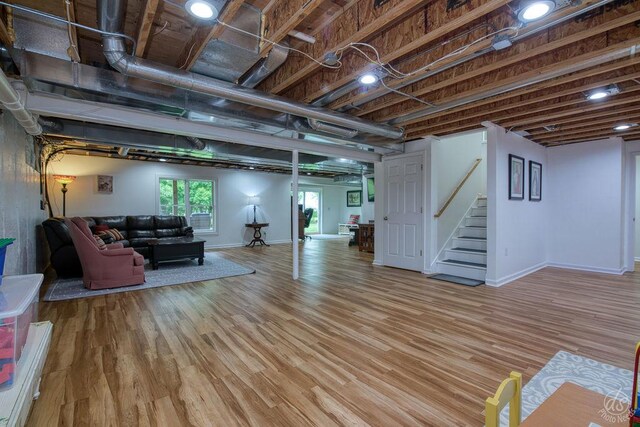 141 Mary Hamsmith Ct, Sycamore, IL 60178 - basement featuring stairway, light wood finished floors, and baseboards