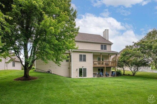 141 Mary Hamsmith Ct, Sycamore, IL 60178 - back of property with a yard, a chimney, and a wooden deck