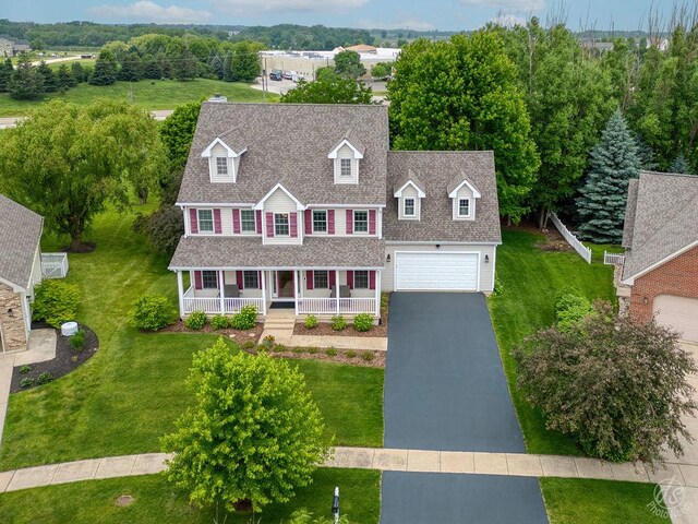 141 Mary Hamsmith Ct, Sycamore, IL 60178 - colonial inspired home with a porch, roof with shingles, driveway, and a front lawn