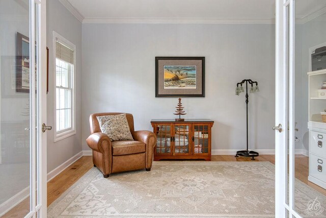 141 Mary Hamsmith Ct, Sycamore, IL 60178 - living area with wood finished floors, ornamental molding, and baseboards