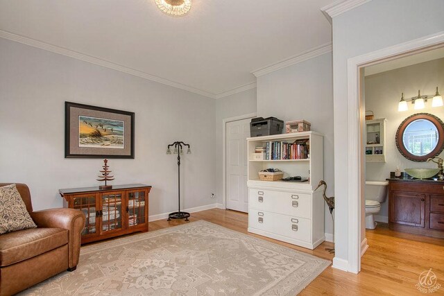 141 Mary Hamsmith Ct, Sycamore, IL 60178 - sitting room featuring light wood-style floors, crown molding, and baseboards