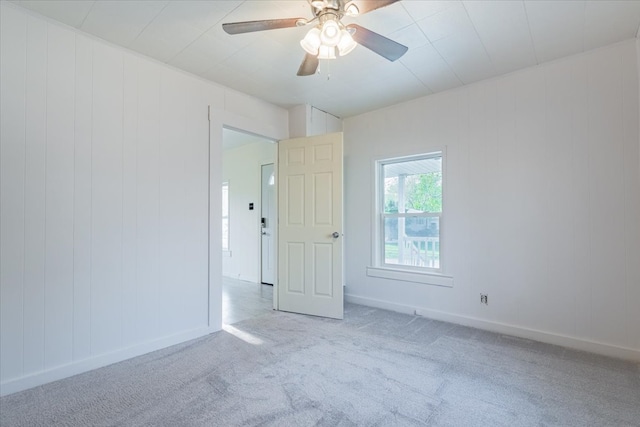 800 E Webster St, Clinton, IL 61727 - carpeted empty room with a ceiling fan and baseboards