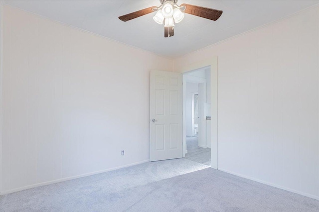 800 E Webster St, Clinton, IL 61727 - spare room featuring carpet, ceiling fan, ornamental molding, and baseboards