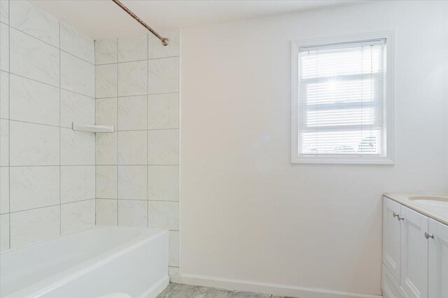 800 E Webster St, Clinton, IL 61727 - full bathroom featuring vanity, bathing tub / shower combination, and baseboards