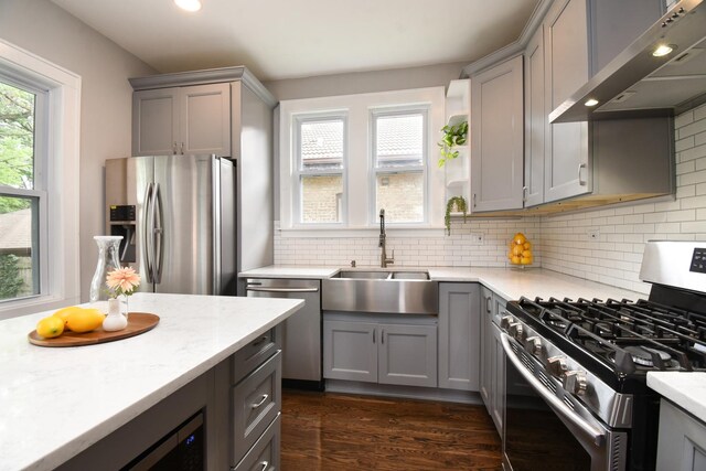 1234 Edmer Ave, Oak Park, IL 60302 - kitchen with stainless steel appliances, wall chimney exhaust hood, gray cabinetry, backsplash, and recessed lighting