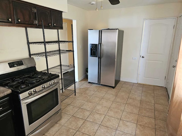 3014 W 163rd St, Markham, IL 60428 - kitchen with stainless steel appliances, light tile patterned flooring, a ceiling fan, and baseboards