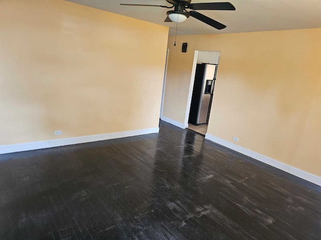 3014 W 163rd St, Markham, IL 60428 - spare room with a ceiling fan, baseboards, and dark wood-style flooring