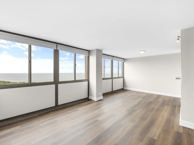 4850 S Lake Park Ave Unit 2508B, Chicago, IL 60615 - empty room featuring wood finished floors and a water view