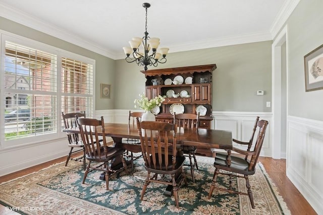 76 Landon Cir, Wheaton, IL 60189 - dining space featuring a chandelier, light wood-style floors, ornamental molding, and a wainscoted wall
