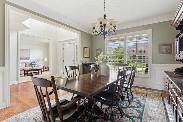 76 Landon Cir, Wheaton, IL 60189 - dining space with a chandelier, light wood finished floors, crown molding, and wainscoting