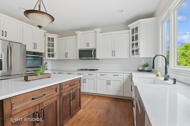 76 Landon Cir, Wheaton, IL 60189 - kitchen with stainless steel appliances, white cabinets, light wood-style floors, backsplash, and recessed lighting