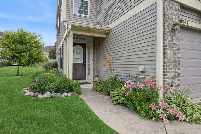 6941 Brightwater Dr, Fox Lake, IL 60020 - entrance to property with a yard and a garage