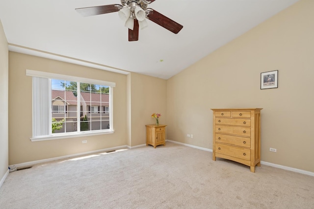 6941 Brightwater Dr, Fox Lake, IL 60020 - unfurnished room with light colored carpet, lofted ceiling, and ceiling fan