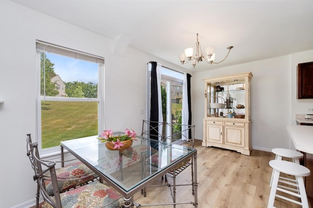6941 Brightwater Dr, Fox Lake, IL 60020 - dining space featuring a chandelier and light wood-style floors