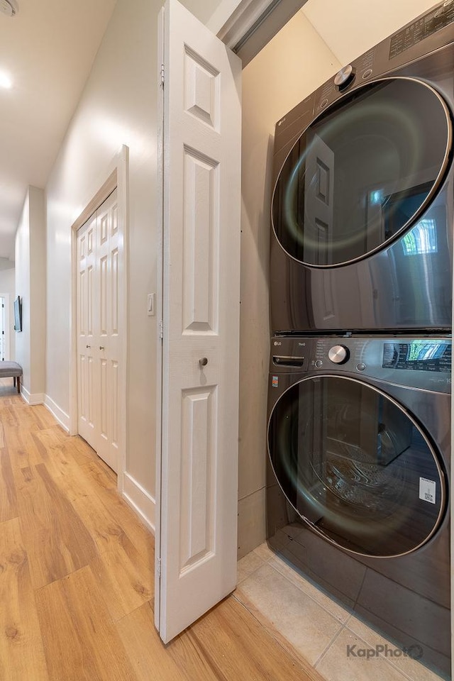 2414 W Grenshaw St Unit 1E, Chicago, IL 60612 - laundry room with estacked washer and dryer and light wood-style floors